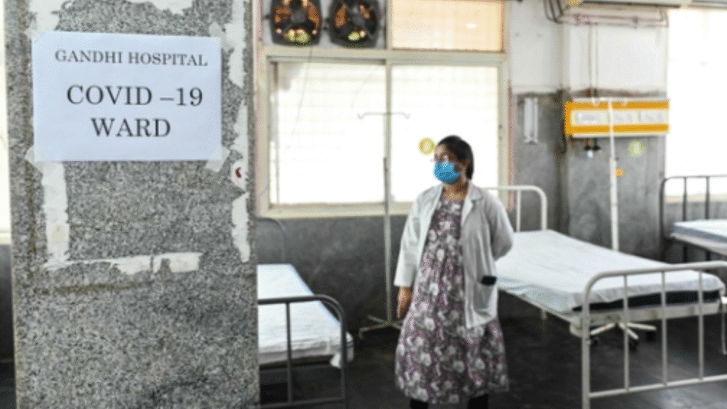 A doctor examines a COVID-19 isolation ward set up for symptomatic patients at a government hospital in Secunderabad, Telangana, on May 24.