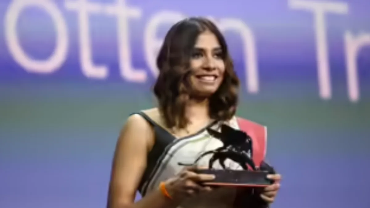 Anuparna Roy Award ceremony with trophy presentation.