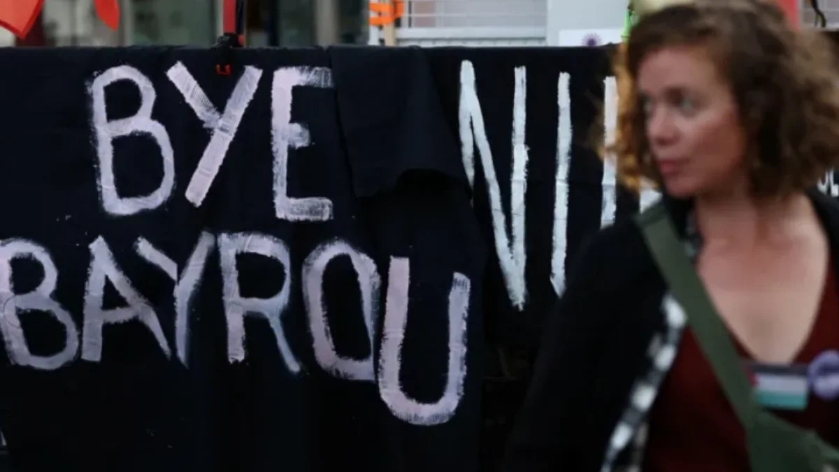 Protest sign saying 'Bye Bayrou' to pm Francois Bayrou