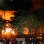 A group of people set fire to The Daily Star newspaper office building, following the death of Sharif Osman HadiMuhammad Yunus urges peace after Bangladesh political unrest