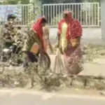 Wide-angle view of Hubballi-Dharwad city main road during cleanliness drive, sanitation workers cleaning roads