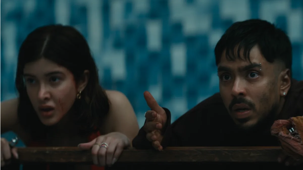 Adarsh Gourav and Shanaya Kapoor in a tense survival scene from the film Tu Yaa Main inside an empty swimming pool