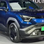 Maruti Suzuki e-Vitara electric SUV front profile view showcasing LED headlights and modern EV design in India launch event