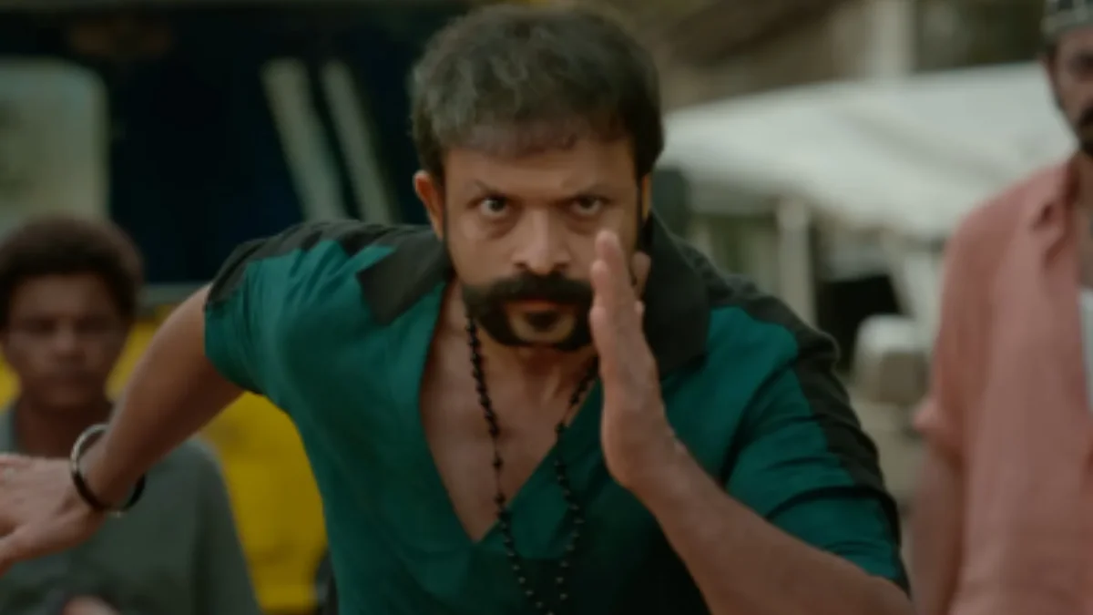 Jayasurya in a scene from Aadu 3 showing a serious expression during a dramatic moment
