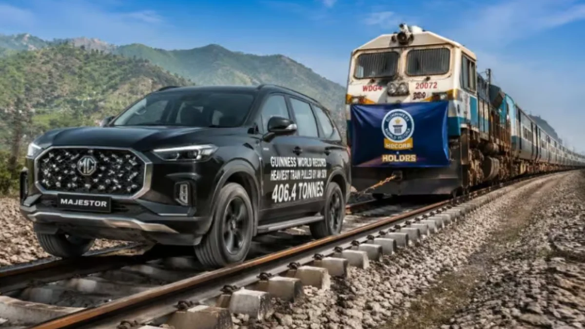 MG Majestor SUV pulling a heavy train during Guinness World Record attempt on railway track