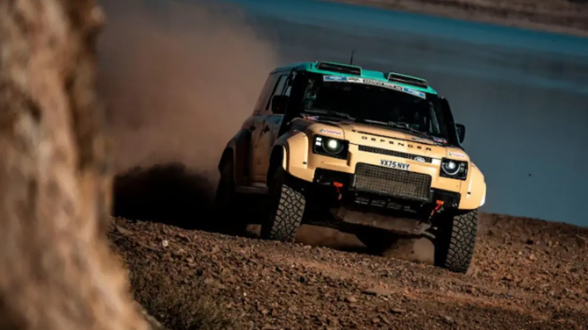 Defender Dakar D7X-R rally SUV competing in the Desafio Ruta 40 rally across challenging desert and mountain terrain in Argentina