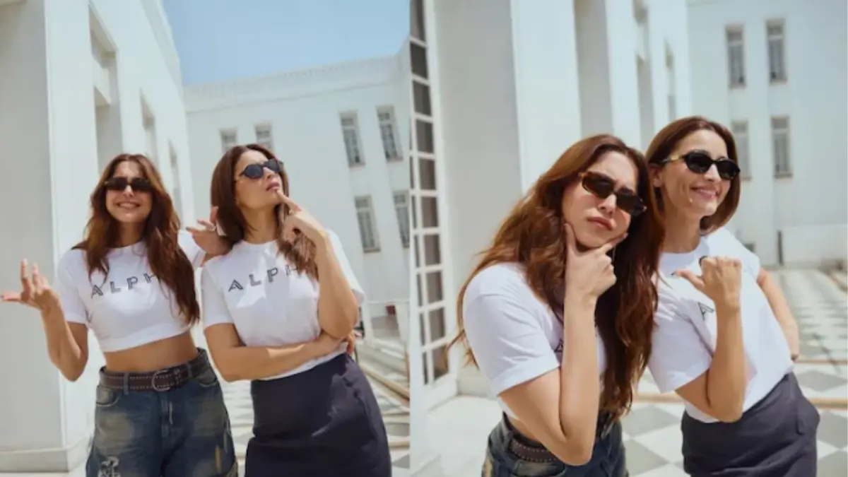 Alia Bhatt and Sharvari posing together during Alpha movie promotion amid social media debate over Sharvari's absence in the teaser.
