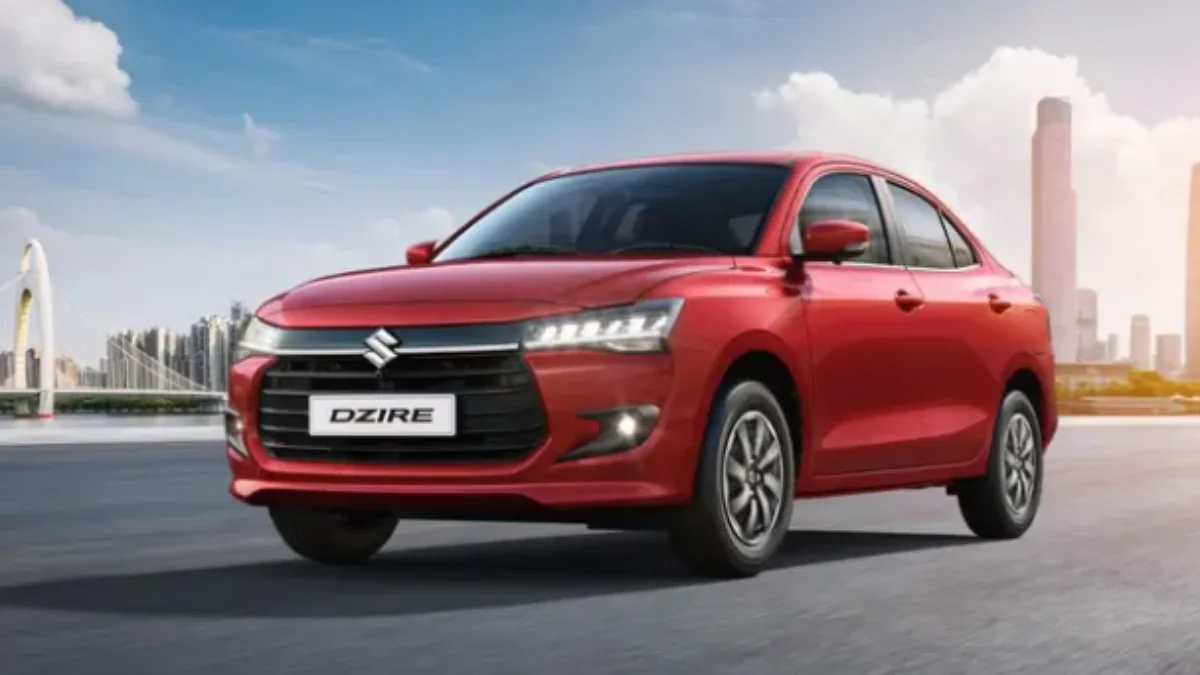 Front view of the 2025 Maruti Suzuki Dzire LXi base variant in Red color showcasing its exterior design and safety-focused family sedan styling.