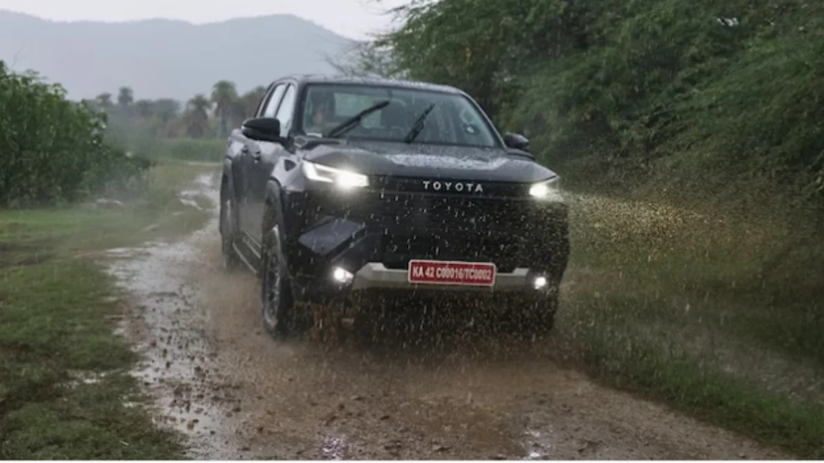 2026 Toyota Hilux lifestyle pickup truck driving on an off-road trail